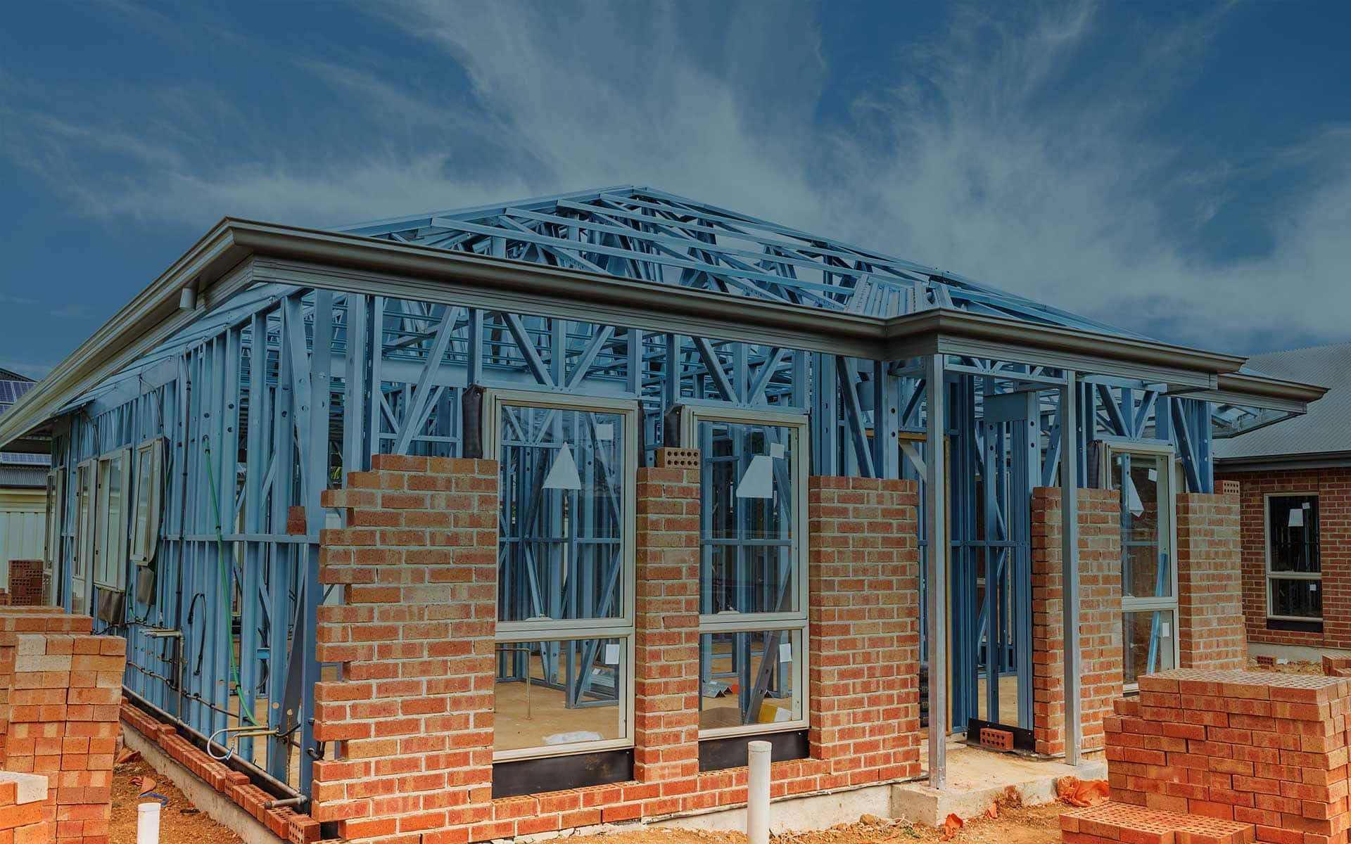housing structure being built with steel and brick