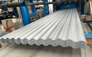 Corrugated metal sheets at factory.